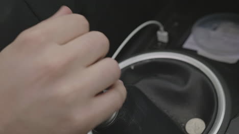 Slow-motion-close-up-of-a-person-shifting-gears-on-a-standard-manual-car