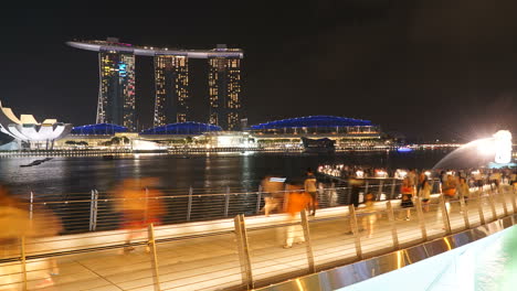 Singapore---Circa-Singapore-city-night-lapse,-pedestrian-viewing-modern-city-skyline-at-night