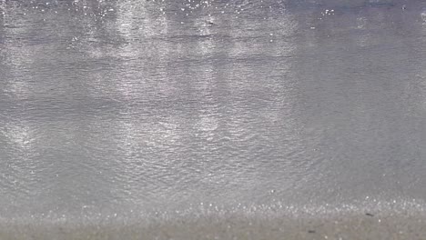 static-Slowmotion-shoot-for-sea-wave-move-in-covering-sand-beach