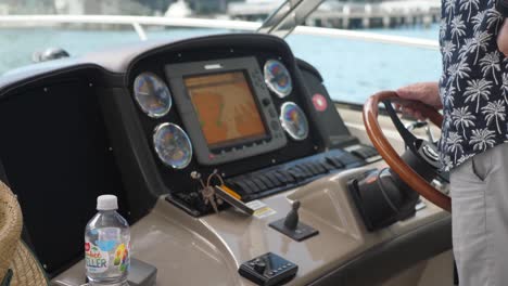Closeup-of-a-man-driving-a-private-boat