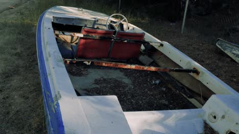 An-abandoned-boat-with-only-two-seats-and-the-steering-wheel