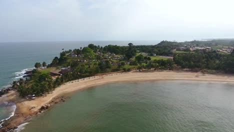 Closing-in-aerial-shot-of-a-coast-and-beach-resort-in-Mermaids-Bay-San-Pedro-in-Southwest-Ivory-Coast-Africa
