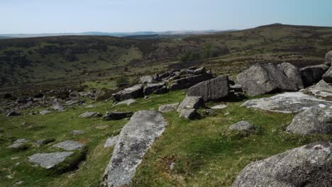 View-over-the-rugged-and-lonely-terrain-of-Dartmoor-from-Sharp-Tor-in-Devon-England-on-a-hot-spring-day