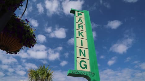 Push-in-parallax-shot-of-old-parking-sign-in-Myrtle-Beach,-South-Carolina