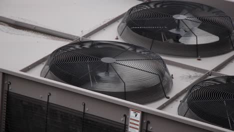 Urban-Fan-with-Rust-spins-in-high-speed-as-part-of-the-HVAC-air-conditioning-unit-on-top-of-city-buildings