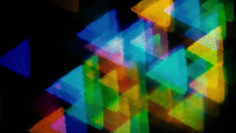 Reluciente-Forma-De-Triángulo-Bokeh-Luces-Multicolores-Bailando-En-Tono-Negro-Festivamente