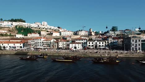 PORTO,-PORTUGAL,-MAY-15-2019:-Aerial-drone-shot-orbiting-Gaia-city-in-Porto-region