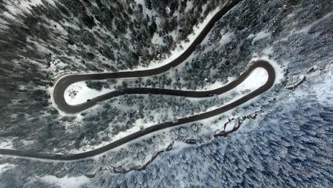 AERIAL:-Road-in-Forest-with-snow-in-Dolomites