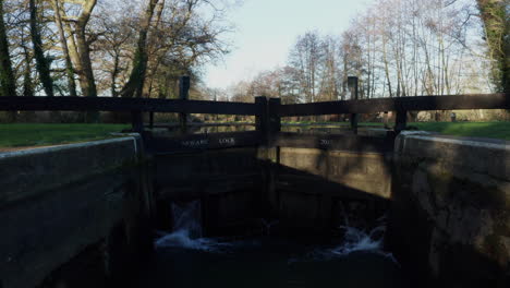 Closed-canal-lock-gates,-raising-above-lock-gates