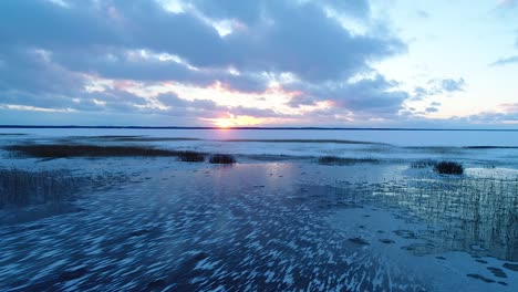 Super-cold-frozen-lake-in-evening-sunset-blue-light