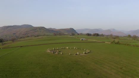 Castlerigg-Stone-Circle-fly-by-drone-shot-during-the-magic-hour-after-Sunrise