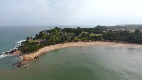 Aerial-view-of-a-resort-and-clean-smooth-beach-in-Mermaids-Baby-in-San-Pedro-Ivory-Coast