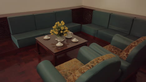 Lounge-area-of-former-murdered-President's-bedroom-with-coffee-table,-flowers-and-tea-set