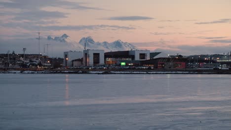 Tall-mountains-behind-Beagle-channel-and-Ushuaia,-the-southernmost-city-at-sunset
