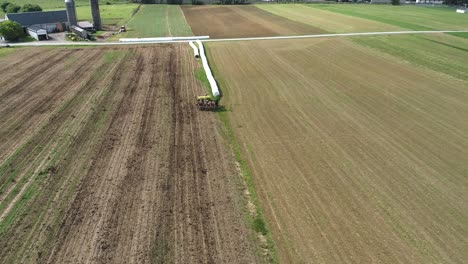 Aerial-View-of-Amish-Farmer-Seeding-His-Field-with-6-Horses