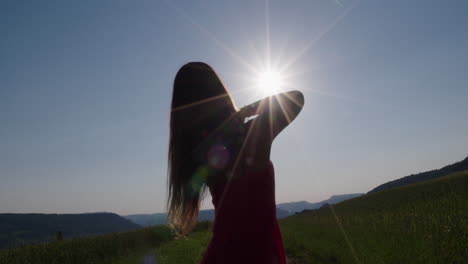 Female-silhouette-is-dancing-in-front-of-the-sun