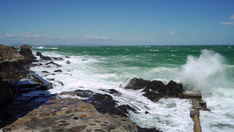 Powerful-waves-smash-into-rugged-rocks-during-high-winds-and-storm-near-Collioure-in-the-south-of-France