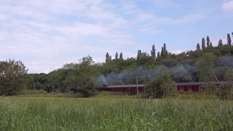 Narrow-Shot-of-the-Flying-Scotsman-60103-Steam-Train-Passing-By-the-Rural-Outskirts-of-Leeds-on-a-Summerâ€™s-Day-in-Slow-Motion