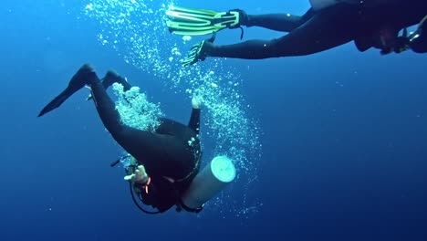 Diver-making-tumble-turn-while-diving