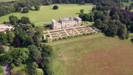 Downward-Aerial-Flyaway-of-Harewood-House,-a-Country-House-in-West-Yorkshire,-from-Side-on-Angle