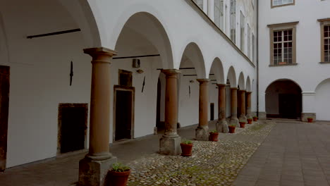 Renaissance-Baroque-palace-in-medieval-European-town,-Castle-in-Slovenska-Bistrica,-Slovenia,-arcades-of-main-building