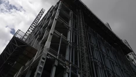 Panning-shot-of-the-skeleton-of-a-building-closes-up-in-Dublin-city-under-construction