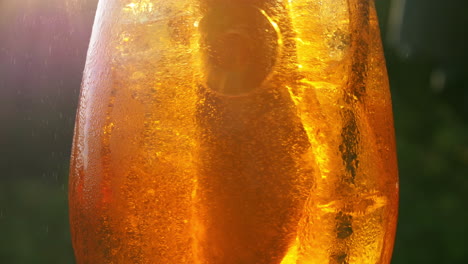 Refreshing-orange-drink-in-the-sun---4K-60fps