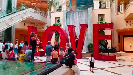 Photoshooting-of-young-gymnast-girls-with-the-LOVE-sign-art-installation-inside-The-Palazzo-:-The-Venetian-in-Las-Vegas,-Nevada,-United-States