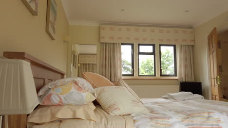 Left-to-Right-Pan-of-a-Contemporary-Guest-Bedroom-with-En-Suite