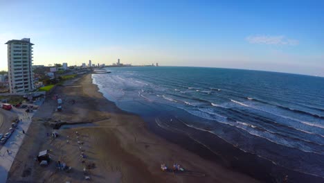 Aerial-view-drony-with-drone-of-the-beach-of-Boca-del-Rio,-Veracruz,-with-the-shadow-of-the-buildings-projected-on-the-ocean