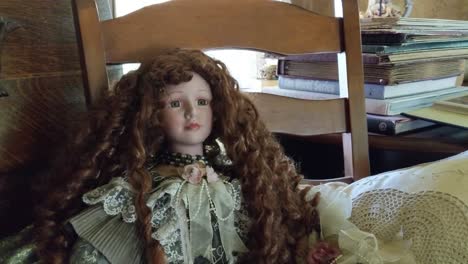 Antique-girl-dolls-sitting-and-staring,-red-head,-blonde,-creepy