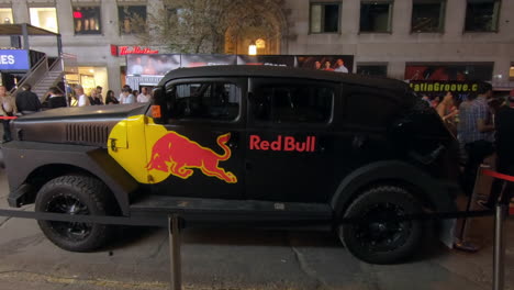Editorial,-view-of-promotional-vehicle,-a-beautiful-black-truck-,-pick-up,-labeled-with-red-bull-logo,-exposed-in-the-street-for-a-summer-public-street-event