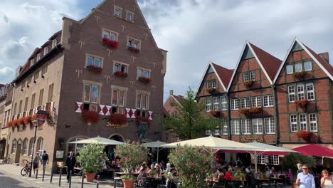 View-of-the-small-and-large-Kiepenkerl-restaurant-building-on-in-Muenster-Germany-on-a-sunny-day