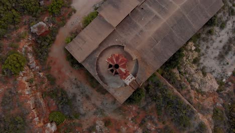 Lime-factory-ruins-in-Portugal,-top-down-drone-view,-rotating-clockwise