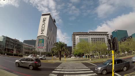 Herengracht-street-time-lapse-capturing-pedestrians---vehicles-in-front-of-the-Media24-centre-in-the-Foreshore-in-Cape-Town,-South-Africa