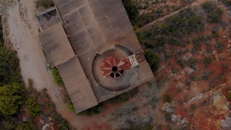Quicklime-factory-Portugal,-top-down-drone-view,-rotating-clockwise-and-lowering