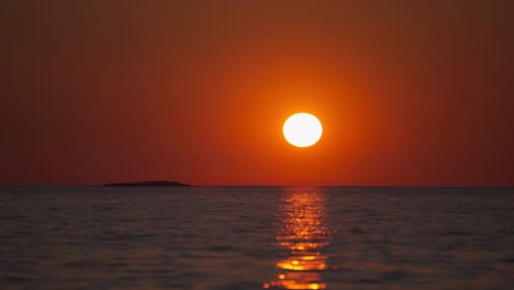 The-sun-is-setting-at-the-Croatian-seaside-in-summer-above-gentle-waves