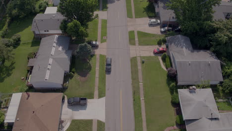 flyover-suburban-neighborhood-and-street-with-a-crosswalk
