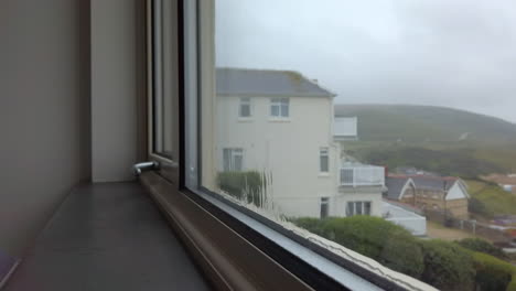 Rain-Flowing-Down-a-Window-with-a-Sea-View