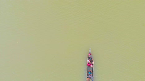 4k-Aerial-Top-Down-shot-of-People-in-a-Row-Boat-getting-evacuated-to-land-area-in-Majuli-river-island-submerged-in-the-Brahmaputra-Monsoon-floods