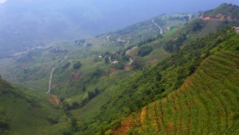 Aerial-dolly-forward-over-the-misty-mountains-of-northern-Vietnam