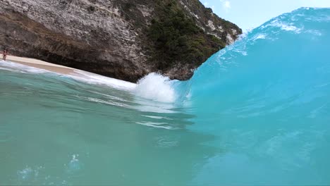 Extreme-Slow-Motion-shot-of-being-inside-the-barrel-of-a-large-wave-at-KelingKing-Beach,-on-the-island-of-Nusa-Penida,-Bali,-Indonesia