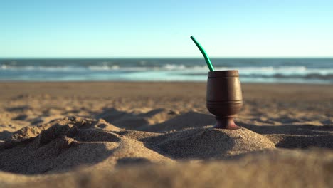 Mate-infusion-in-the-sandy-beach-on-summer-holiday-sunny-day,-summertime-vacation