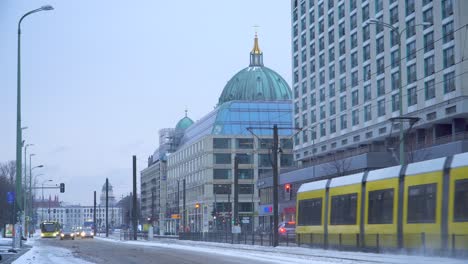 Yellow-Colored-Public-Transport-Trains-on-Snowy-Streets-of-Berlin
