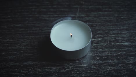 Tealight-is-extinguished-and-releases-smoke,-slow-motion-120fps