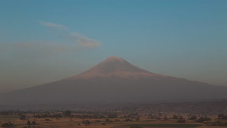 View-of-Popocatepetl-volcanic-mountain-against-the-blue-sky-in-4K