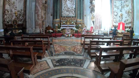 Inside-Sant'Agnese-in-Agone-in-Rome,-Italy,-Camera-tilts-up