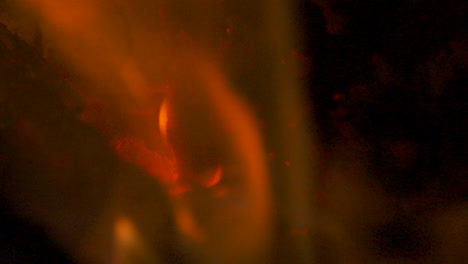 Slow-motion-macro,-flames-burning-in-a-red-hot-fire