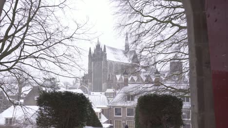 Burcht-van-Leiden,-city-reveal-walking-through-fort-gate-in-winter-snow