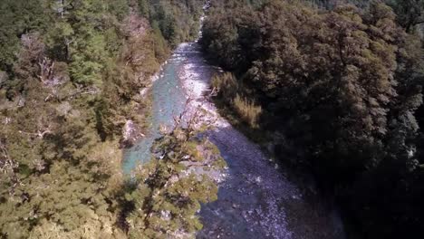 Drone-filming-over-the-mountain-river-on-bright-summer-day